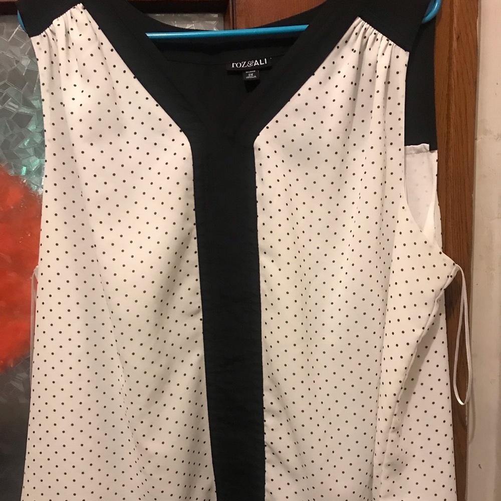 Sleeveless polka dot blouse
